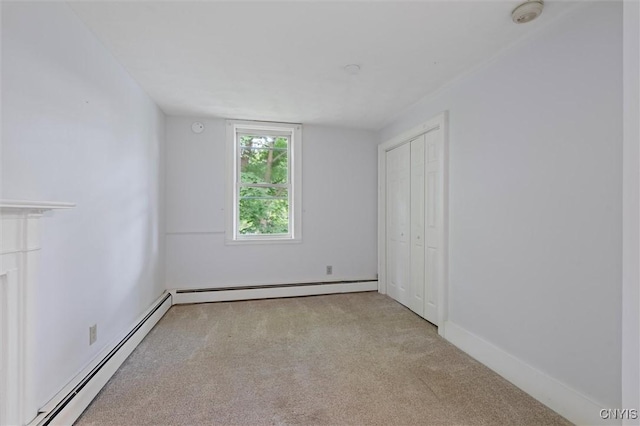 16 Onondaga St, Skaneateles, NY 13152 - unfurnished bedroom featuring a baseboard radiator, carpet, and a closet