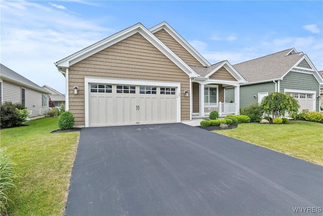 29 Raine Dr, Amherst, NY 14221 - view of front of home featuring covered porch, a front lawn, a garage, and driveway