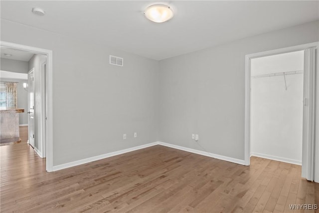 29 Raine Dr, Amherst, NY 14221 - unfurnished bedroom with wood finished floors and a closet