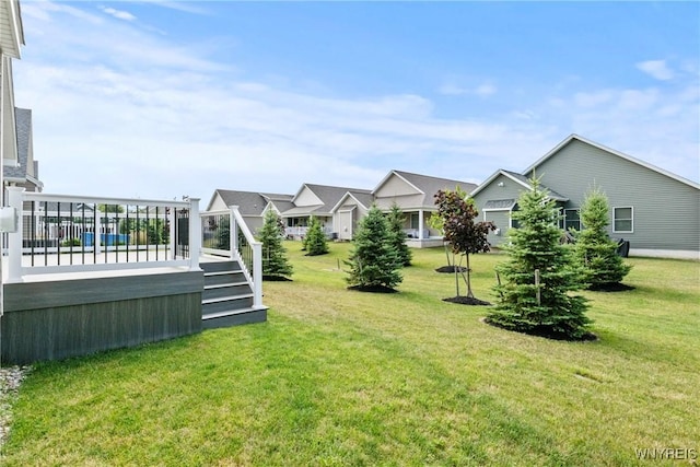 29 Raine Dr, Amherst, NY 14221 - view of green lawn with a wooden deck