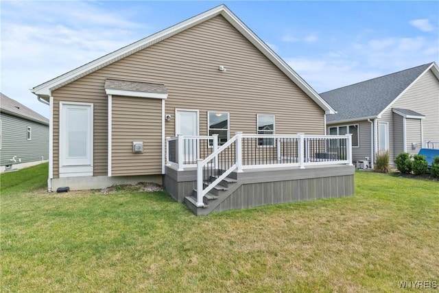 29 Raine Dr, Amherst, NY 14221 - back of property with a lawn and a wooden deck