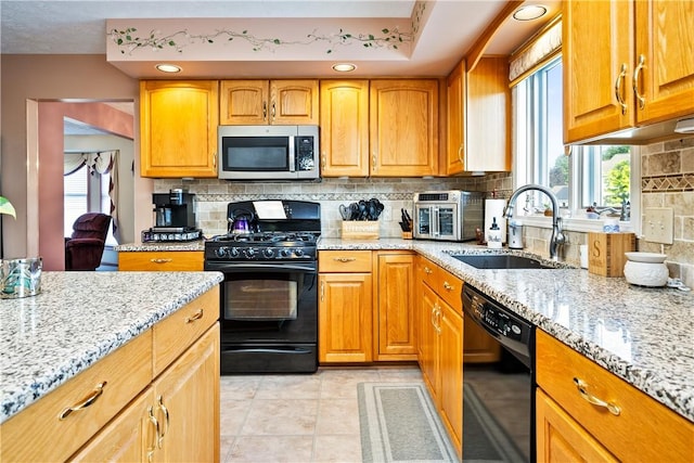 35 Silkwood Cir, Gates, NY 14559 - kitchen featuring black appliances, light stone counters, and healthy amount of natural light