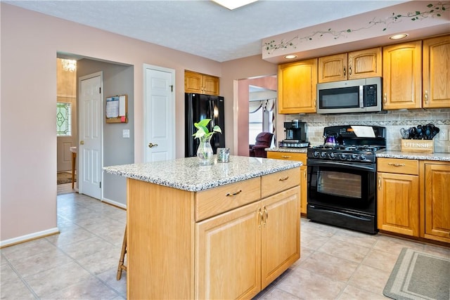 35 Silkwood Cir, Gates, NY 14559 - kitchen featuring black appliances, a center island, light stone countertops, and decorative backsplash