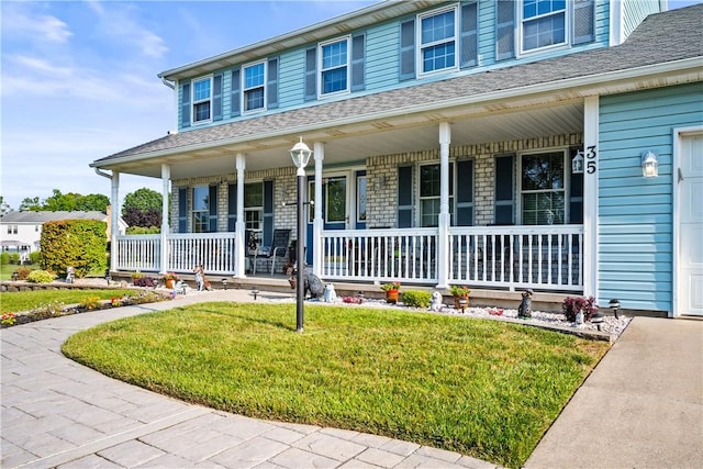 35 Silkwood Cir, Gates, NY 14559 - view of front of home featuring a porch and a front yard