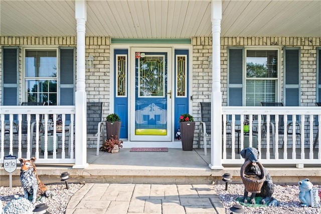 35 Silkwood Cir, Gates, NY 14559 - entrance to property featuring a porch and brick siding
