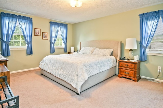 35 Silkwood Cir, Gates, NY 14559 - carpeted bedroom with multiple windows and a textured ceiling