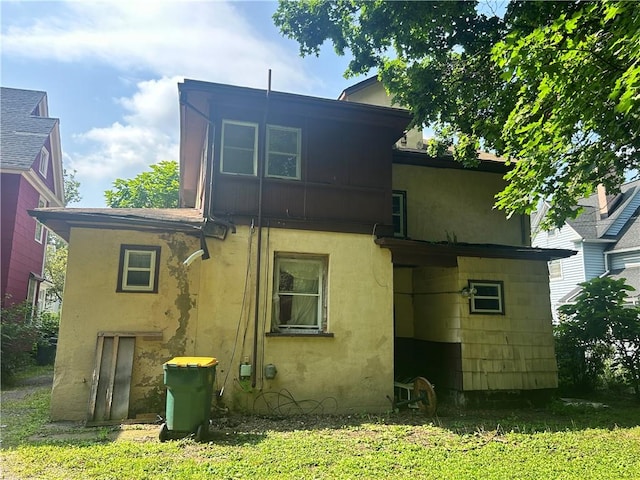 182 Parsells Ave, Rochester, NY 14609 - back of property featuring stucco siding