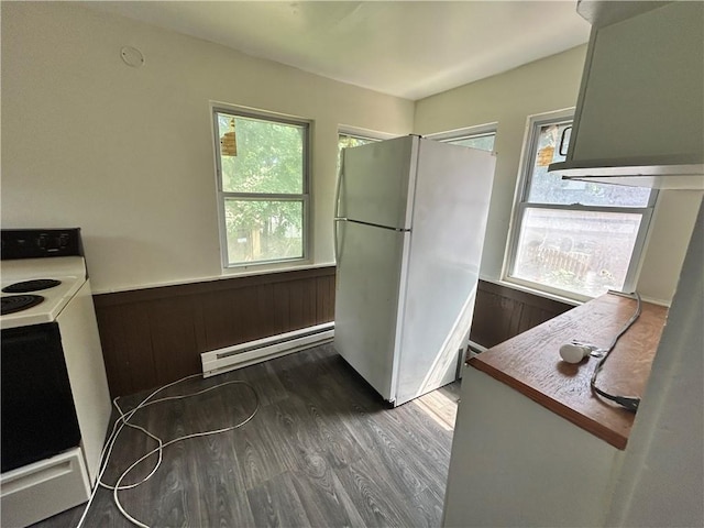 182 Parsells Ave, Rochester, NY 14609 - kitchen with white appliances, a baseboard heating unit, wainscoting, wood finished floors, and healthy amount of natural light
