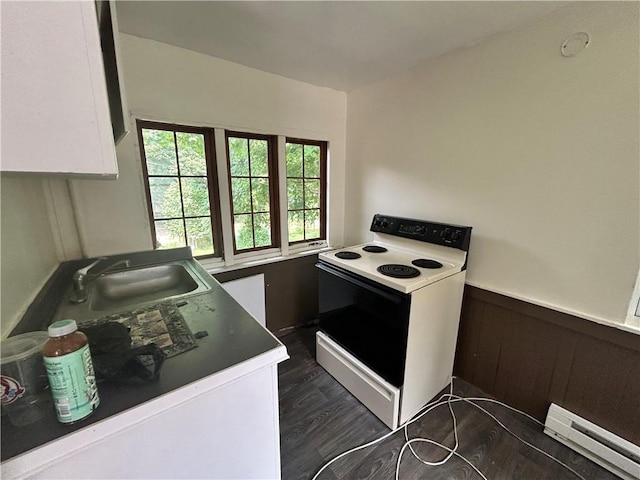 182 Parsells Ave, Rochester, NY 14609 - kitchen with white range with electric stovetop, baseboard heating, dark wood finished floors, and wainscoting
