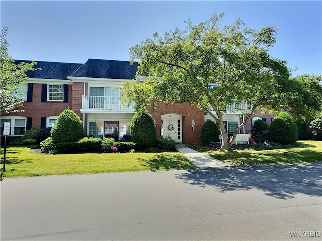 27 Hickory Hill Rd Unit B, Amherst, NY 14221 - view of front of property with a front lawn, roof with shingles, and brick siding