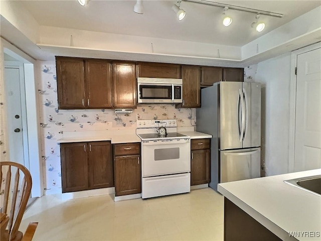 27 Hickory Hill Rd Unit B, Amherst, NY 14221 - kitchen with appliances with stainless steel finishes, light countertops, and dark brown cabinets