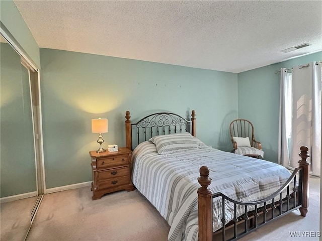 27 Hickory Hill Rd Unit B, Amherst, NY 14221 - carpeted bedroom with a textured ceiling and baseboards