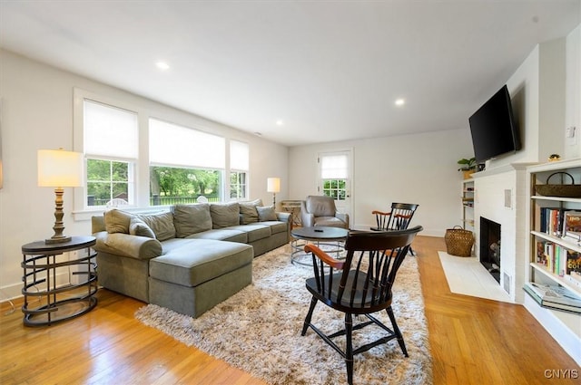53 Payne St, Hamilton, NY 13346 - living area featuring a fireplace, light wood finished floors, and recessed lighting
