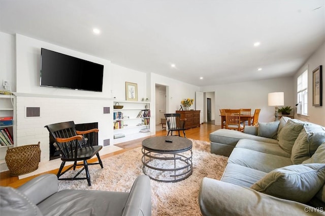53 Payne St, Hamilton, NY 13346 - living area featuring wood finished floors, recessed lighting, and a fireplace