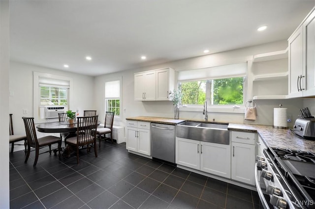 53 Payne St, Hamilton, NY 13346 - kitchen with appliances with stainless steel finishes, dark tile patterned floors, plenty of natural light, recessed lighting, and white cabinets
