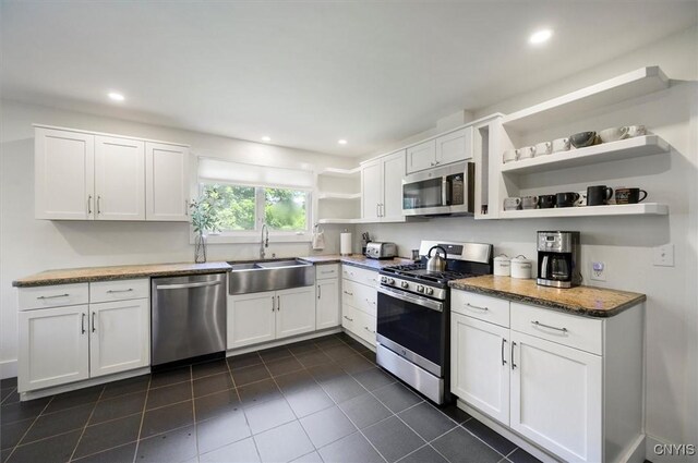 53 Payne St, Hamilton, NY 13346 - kitchen featuring open shelves, stainless steel appliances, dark tile patterned flooring, white cabinets, and recessed lighting