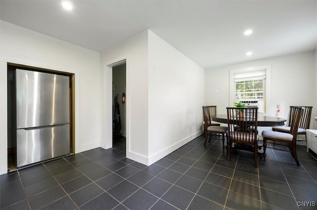 53 Payne St, Hamilton, NY 13346 - dining room with dark tile patterned floors and recessed lighting