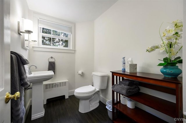 53 Payne St, Hamilton, NY 13346 - half bathroom featuring radiator and wood finished floors