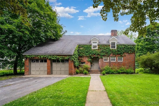 53 Payne St, Hamilton, NY 13346 - view of front of property featuring a front lawn, a chimney, a garage, brick siding, and driveway