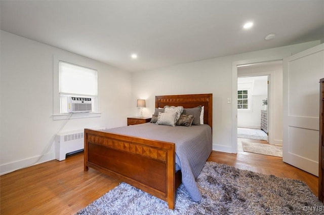 53 Payne St, Hamilton, NY 13346 - bedroom with radiator, wood finished floors, recessed lighting, and cooling unit