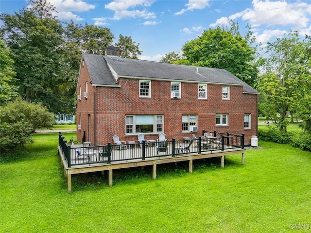 53 Payne St, Hamilton, NY 13346 - rear view of property featuring a yard, brick siding, a chimney, cooling unit, and a wooden deck