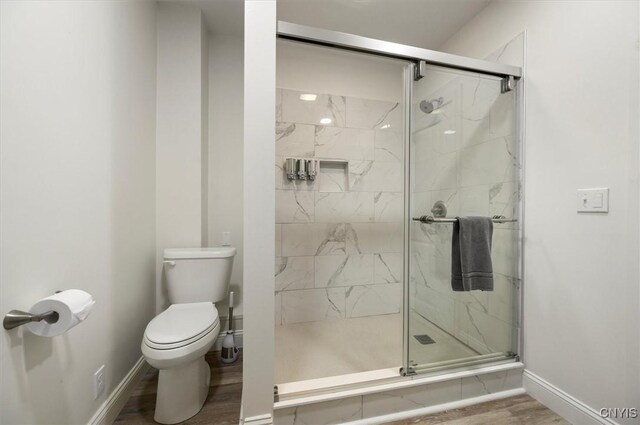 53 Payne St, Hamilton, NY 13346 - full bathroom featuring a marble finish shower and wood finished floors