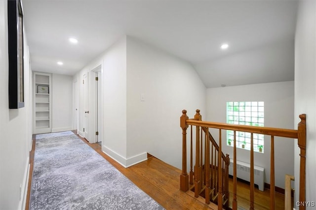53 Payne St, Hamilton, NY 13346 - corridor featuring an upstairs landing, radiator heating unit, wood finished floors, and recessed lighting