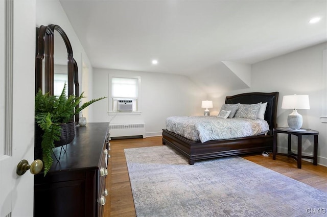 53 Payne St, Hamilton, NY 13346 - bedroom featuring radiator heating unit, wood finished floors, recessed lighting, and cooling unit