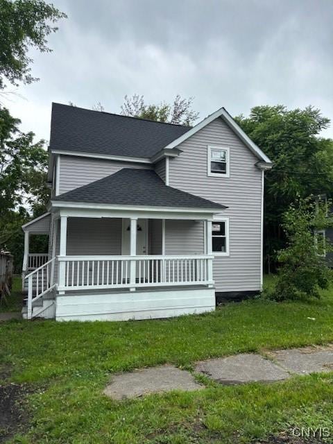 196 Berger Ave, Syracuse, NY 13205 - rear view of house with a porch, roof with shingles, and a lawn