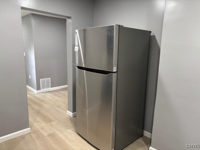 196 Berger Ave, Syracuse, NY 13205 - kitchen with freestanding refrigerator and light wood finished floors