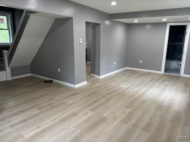 196 Berger Ave, Syracuse, NY 13205 - unfurnished living room with light wood-style floors, recessed lighting, and stairs