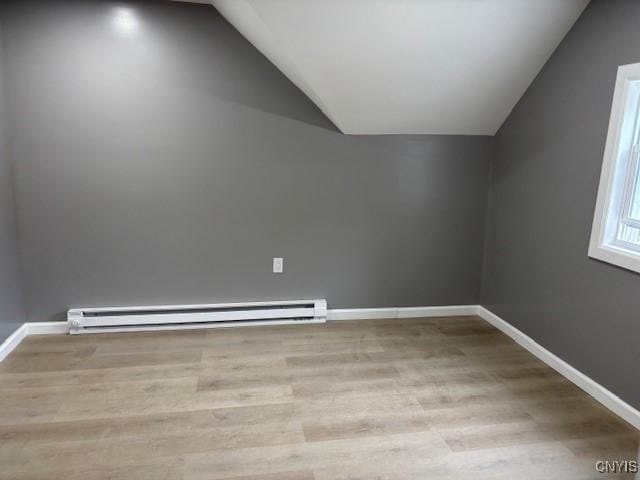196 Berger Ave, Syracuse, NY 13205 - additional living space featuring a baseboard radiator, lofted ceiling, and wood finished floors
