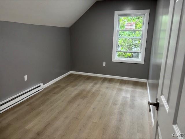 196 Berger Ave, Syracuse, NY 13205 - bonus room with wood finished floors, vaulted ceiling, and baseboard heating