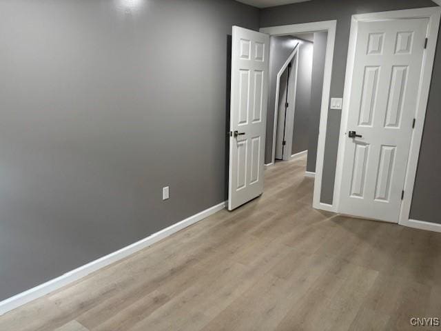 196 Berger Ave, Syracuse, NY 13205 - unfurnished bedroom with light wood-type flooring and baseboards