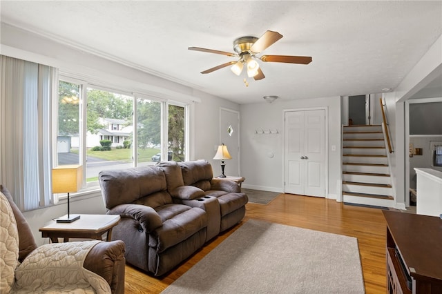 29 Davy Dr, Gates, NY 14624 - living room with ceiling fan, stairs, and light wood-style flooring