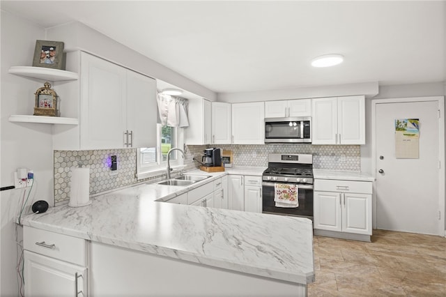 29 Davy Dr, Gates, NY 14624 - kitchen with appliances with stainless steel finishes, open shelves, white cabinets, and decorative backsplash
