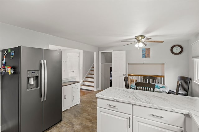 29 Davy Dr, Gates, NY 14624 - kitchen featuring stainless steel refrigerator with ice dispenser, ceiling fan, white cabinetry, and light stone countertops