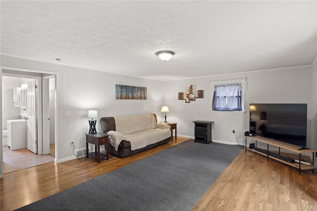 29 Davy Dr, Gates, NY 14624 - living area featuring wood finished floors, a textured ceiling, and crown molding