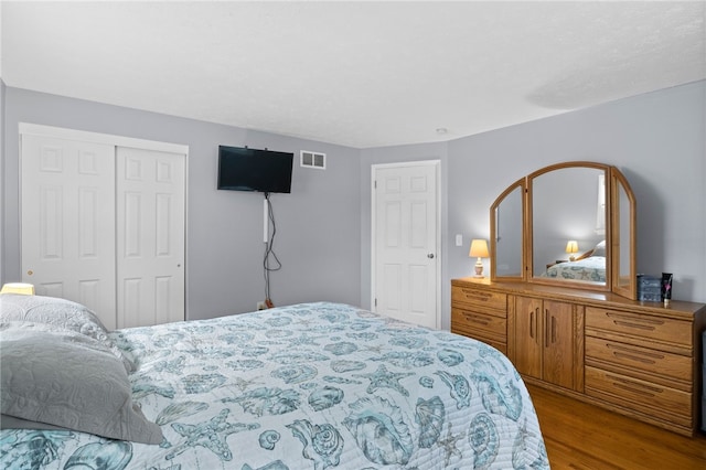 29 Davy Dr, Gates, NY 14624 - bedroom featuring wood finished floors and a closet
