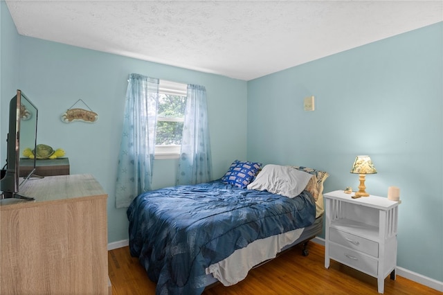 29 Davy Dr, Gates, NY 14624 - bedroom featuring wood finished floors and a textured ceiling