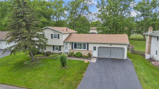 29 Davy Dr, Gates, NY 14624 - tri-level home with asphalt driveway and an attached garage
