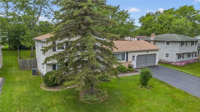29 Davy Dr, Gates, NY 14624 - view of front of property with an attached garage, driveway, and a chimney