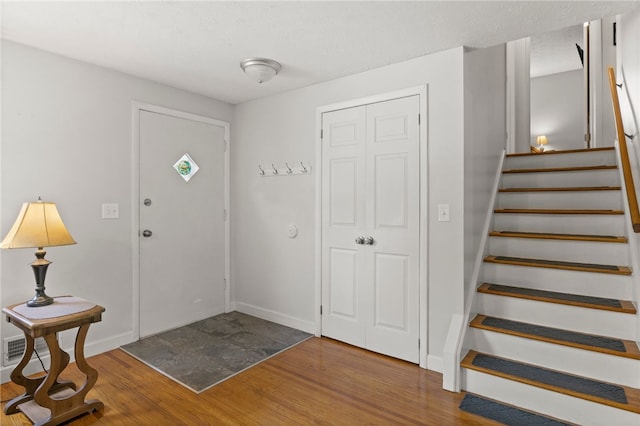 29 Davy Dr, Gates, NY 14624 - entryway with wood finished floors and stairway