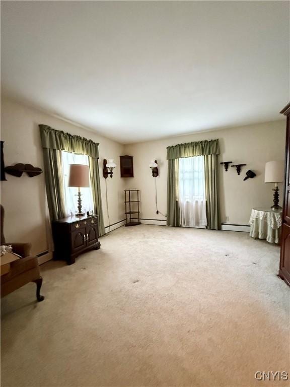 9418 Glenmore Rd Unit Es, Annsville, NY 13471 - unfurnished living room featuring light colored carpet