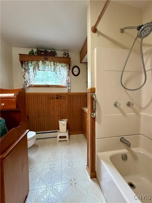 9418 Glenmore Rd Unit Es, Annsville, NY 13471 - full bathroom featuring a baseboard radiator, tub / shower combination, wainscoting, and vanity