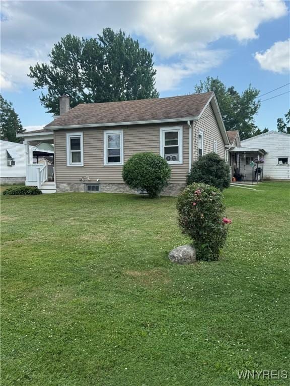 29 Church St, Royalton, NY 14105 - view of front of home with a chimney and a front lawn