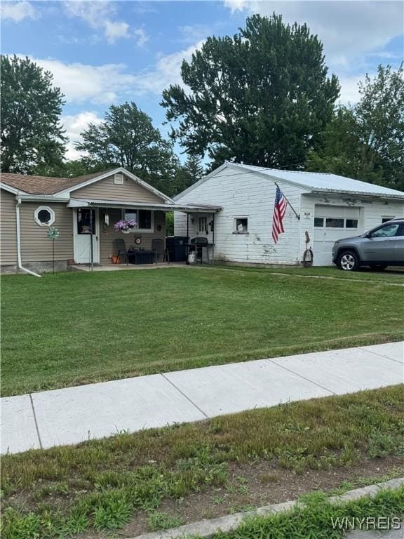 29 Church St, Royalton, NY 14105 - view of front of property with a front lawn and a garage
