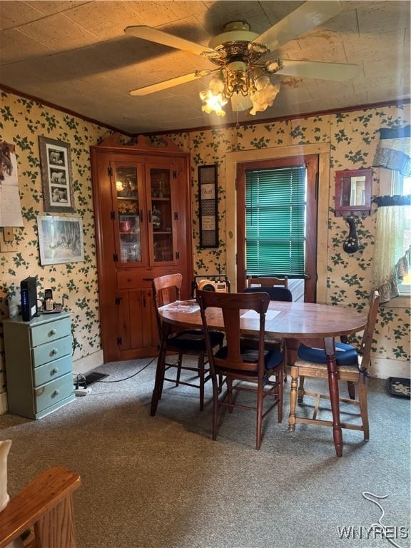 29 Church St, Royalton, NY 14105 - dining space with wallpapered walls, ceiling fan, light carpet, and plenty of natural light