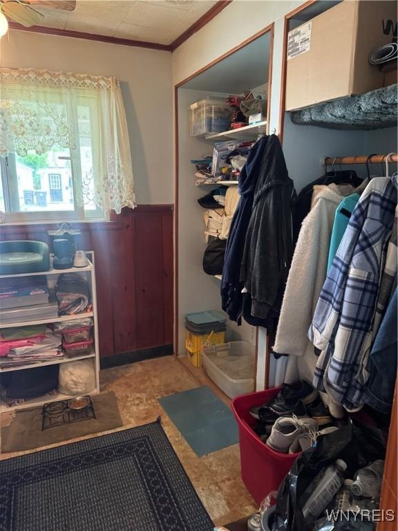 29 Church St, Royalton, NY 14105 - mudroom with a wainscoted wall and a ceiling fan