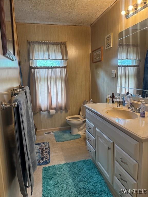 29 Church St, Royalton, NY 14105 - bathroom with vanity and a textured ceiling